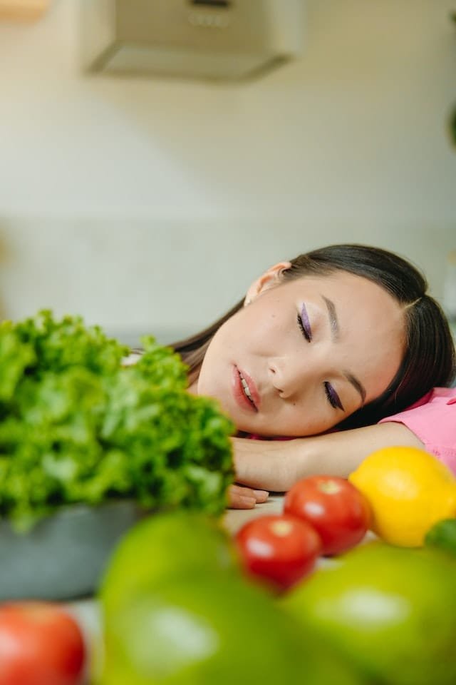 Enrich your spiritual life-A woman is sleeping by fruits and vegetables