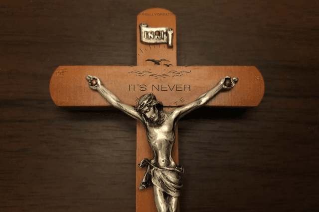 A silver crucifix on a wooden cross